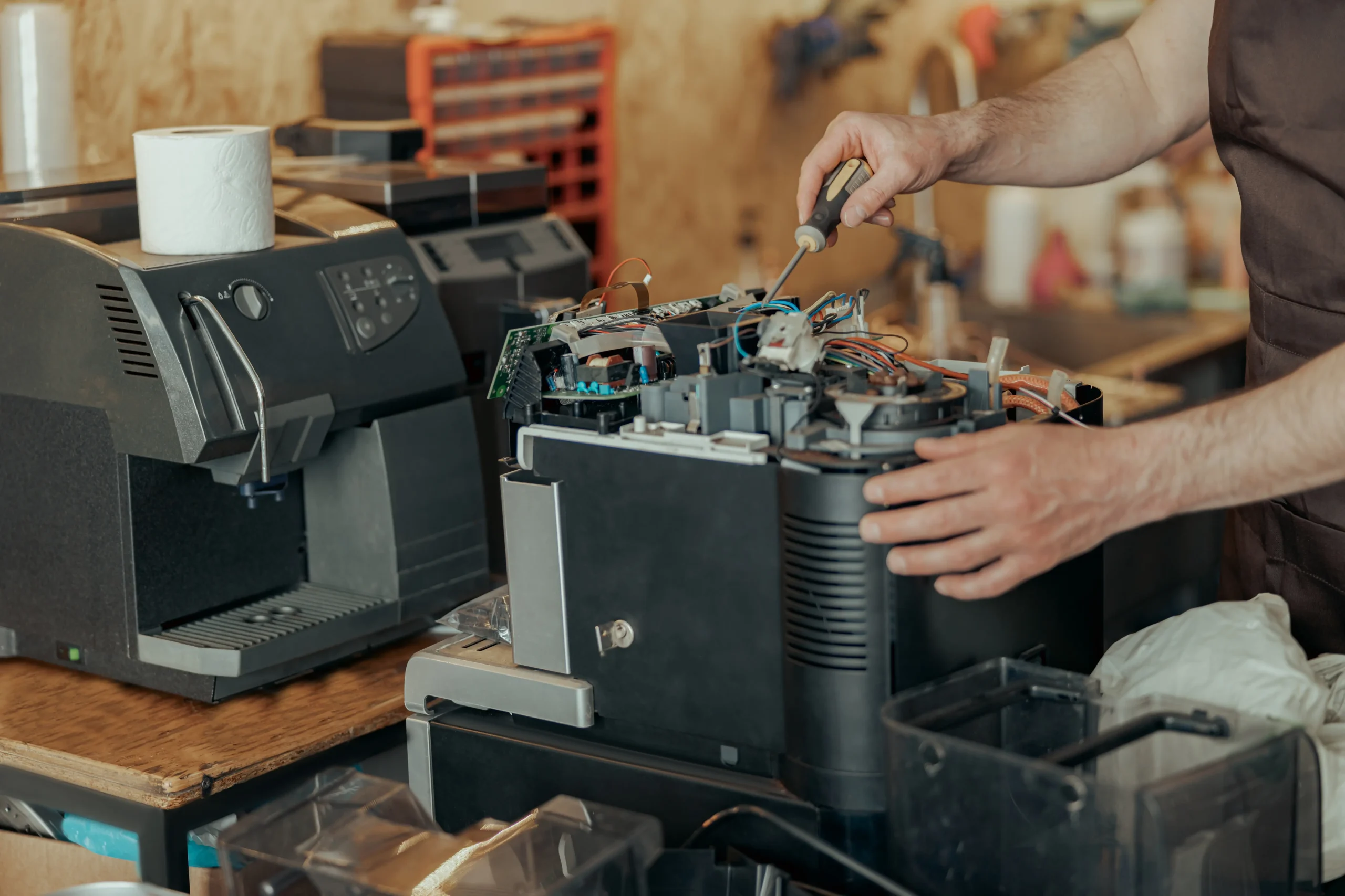 Master Technician Repairing Internal Espresso Machine Pump and Boiler System