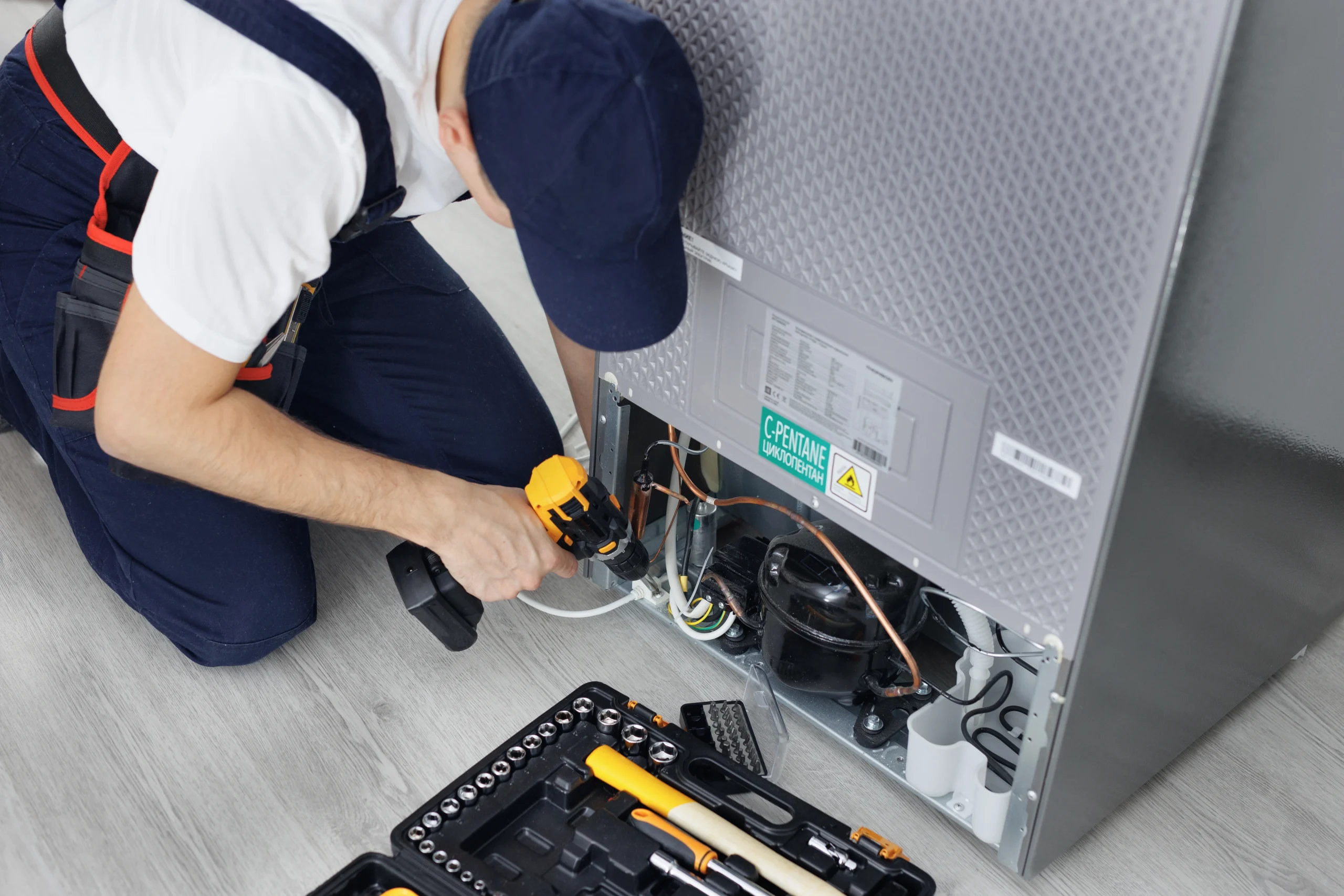 Master Technician Inspecting Internal Laundry Washer Hose Connections