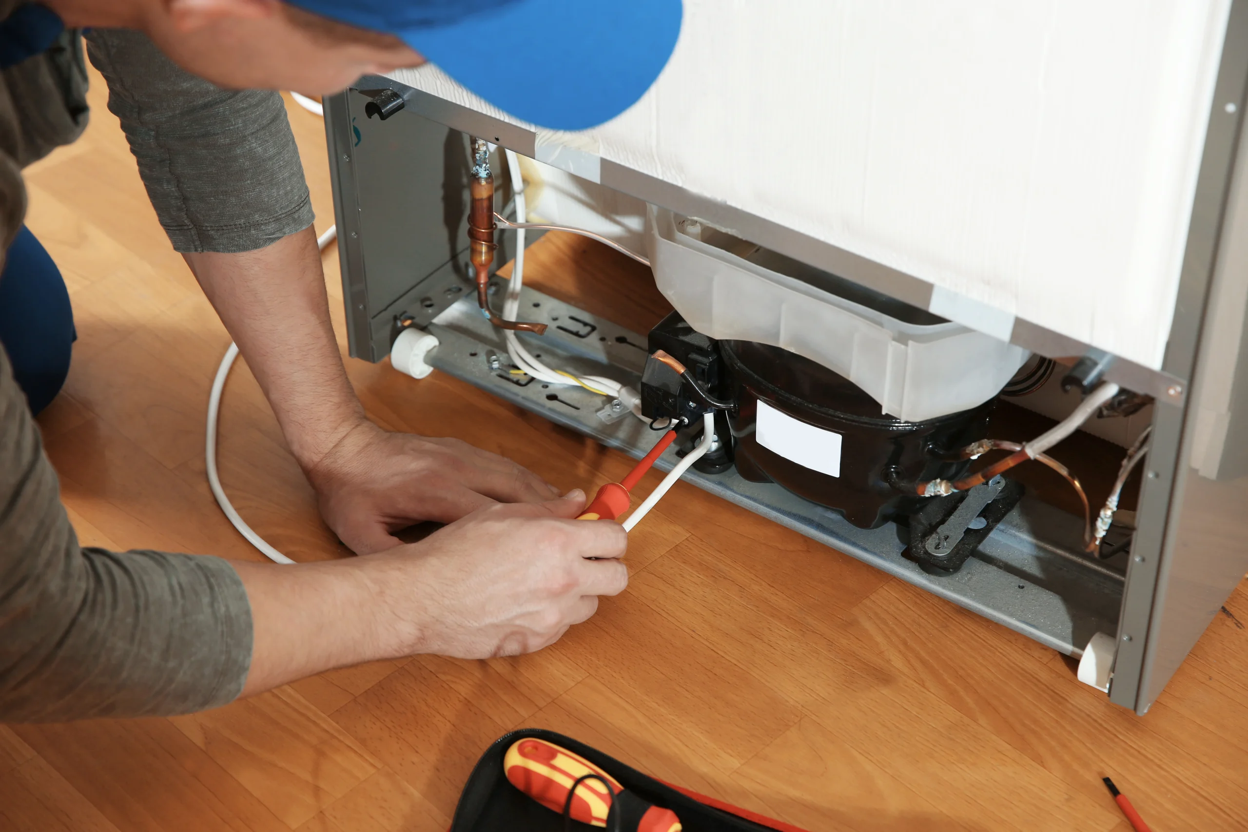 Certified Technician Diagnosing Refrigerator Cooling Failure in Amarillo TX